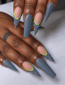 Gray stiletto and coffin nails with neon green outlines, nude cutouts and sculpted 3D geometric tips