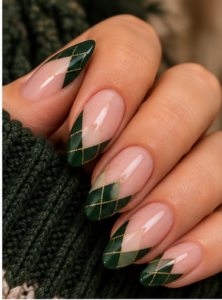 Long almond nails with forest green argyle French tips, sheer pink bases and fine gold lines.