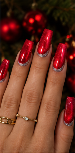 Long square ruby red glitter nails with curved silver glitter crescents near the cuticles.