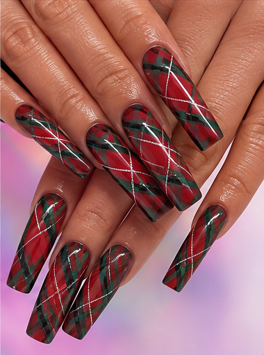 Long coffin nails with glossy red polish, forest green tartan stripes, black lines and white accents.